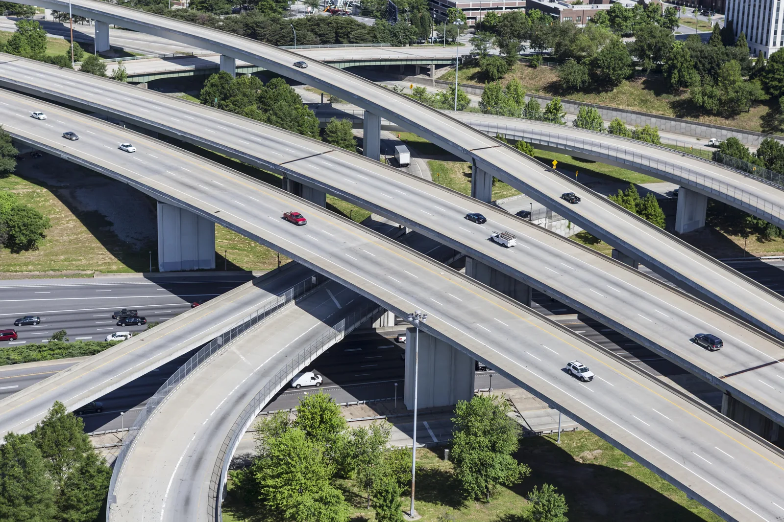 Aerial view of a multi-level highway interchange with concrete overpasses.