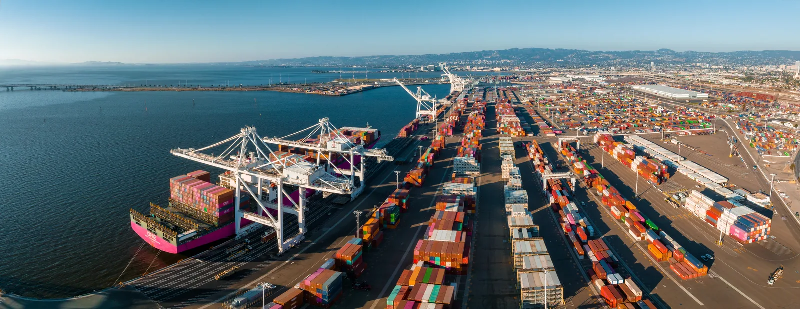 An aerial view of the Port of Oakland shipping terminal highlighting maritime infrastructure.