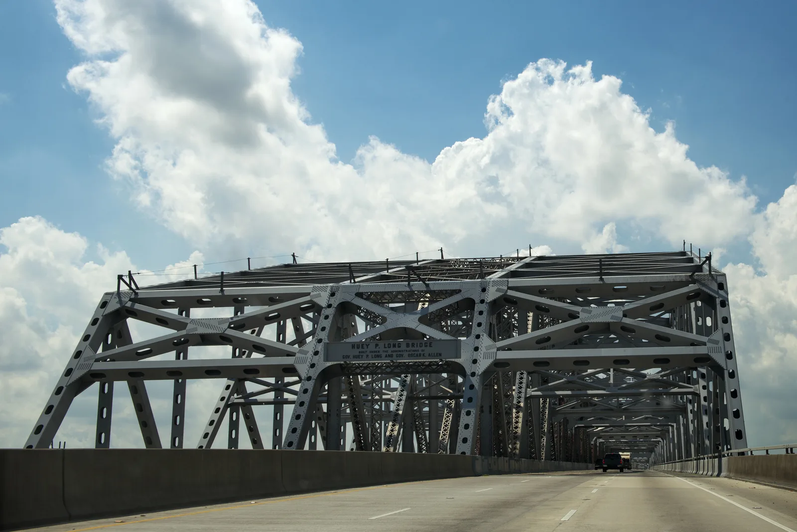 Steel truss superstructure of the Huey P. Long Bridge carrying vehicle traffic.