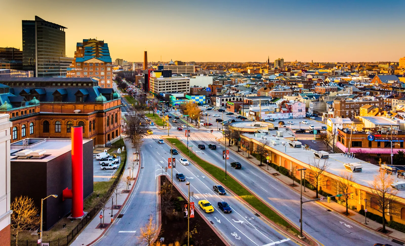 Downtown Baltimore cityscape featuring streets and architecture at sunset