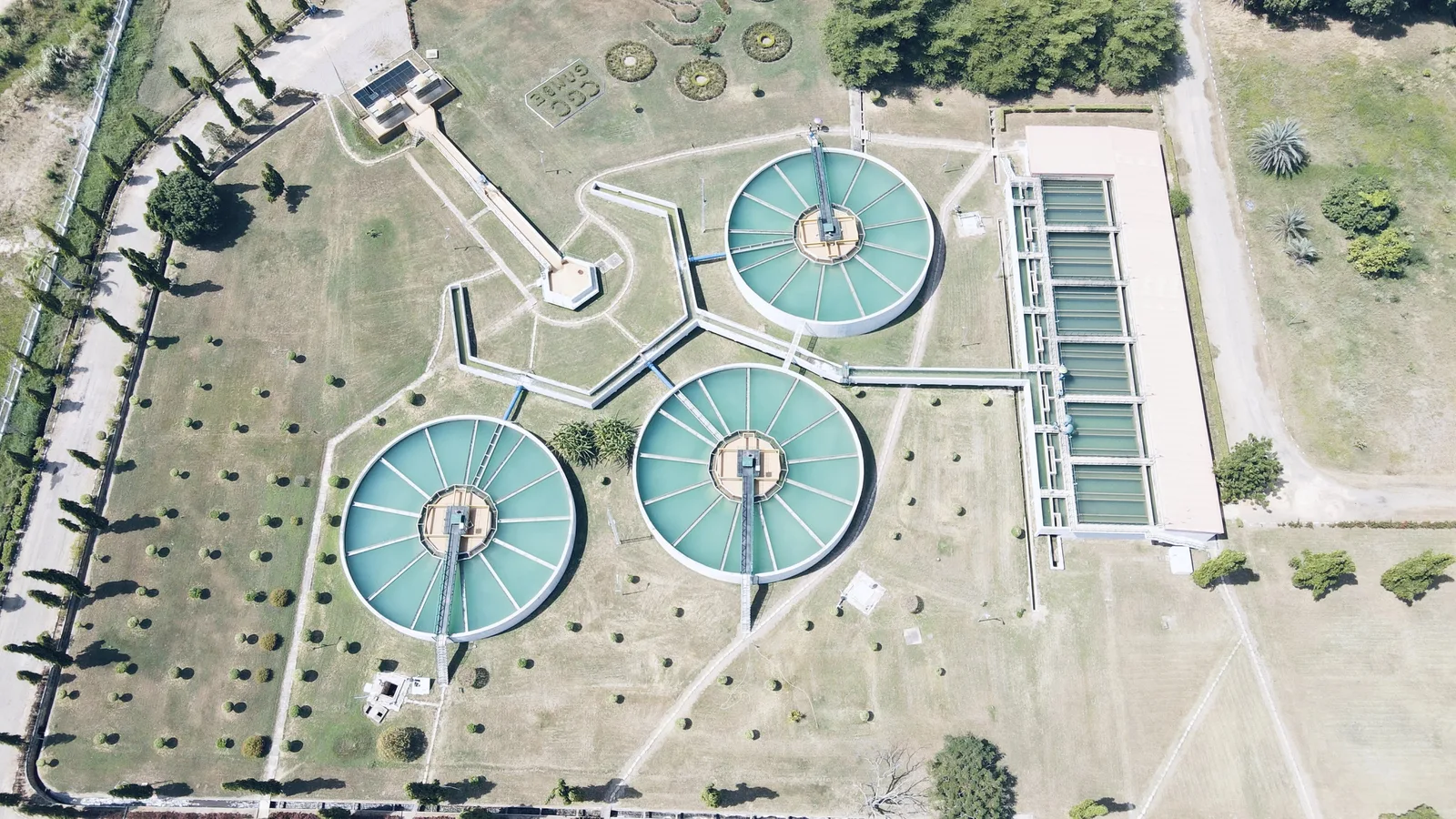 Aerial view of circular clarifiers and basins at a water treatment plant.